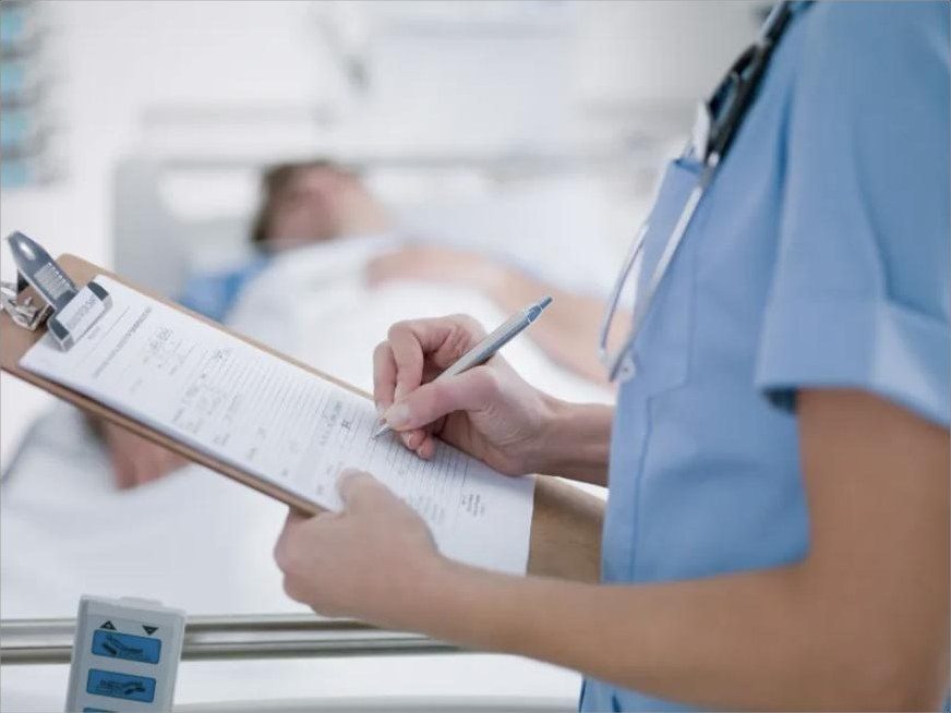 Clinician reviewing a patient chart